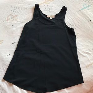 Women’s black blouse in a tank top style.